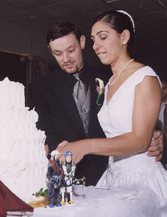 The photo is our cake cutting. The figures in the front were our cake toppers, which I (Misfit4) sculpted and painted of two mountain climbers.