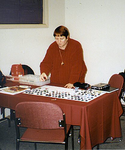 Lisa G setting out her display of painted FA scale B5W ships for a demo