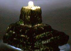 Crystal skull on stone plinth