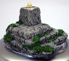 Crystal skull on stone plinth