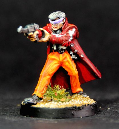 Male firing handgun, long coat, and shades