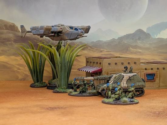 A Voron makes a low pass over a Shershem tank destroyer and accompanying infantry.