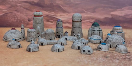 An array of very small scale sci-fi desert buildings
