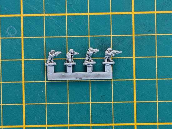Sprue of four 6mm figures, ink-washed to show the detail