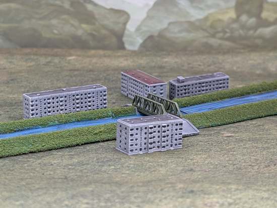 1:1000th scale model canal bridge with apartment blocks either side