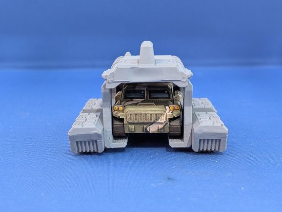 Rear view with Polevka tracked jeep onboard