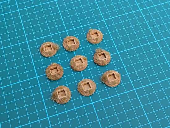 Small dice holders on gridded background