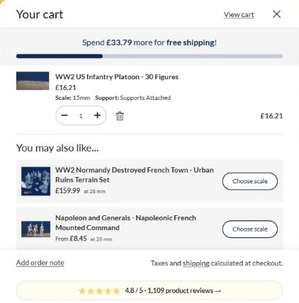 The open basket tracks your progress towards free delivery. This U.K. example has 16.21 GBP in the basket and 33.79 GBP left to reach the target. Your destination determines the free-delivery threshold