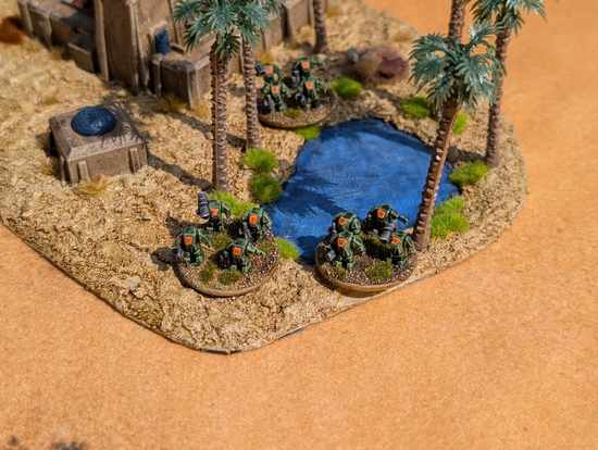 Titan power armor near an oasis