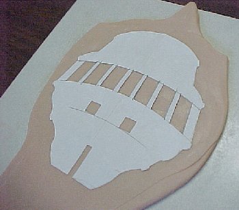 template placed on the sheet of Super Sculpey