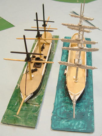 Scratchbuilt masts (left) and masts from kit