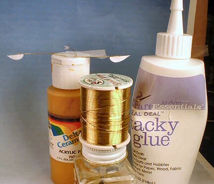 Glue the folded shapes to short sections of 28-gauge brass wire with craft Tacky Glue