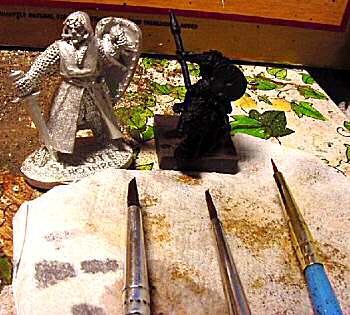 The three brushes (shown with 28mm figure and 15mm Wolf Rider for comparison)