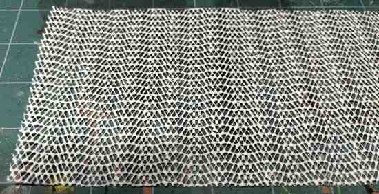 Scrap of non-slip shelf liner