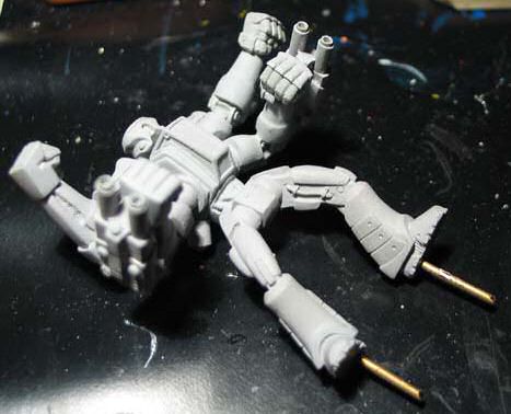 Primed model - notice the pins in his feet